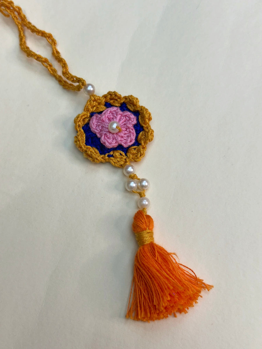 Golden Frame Crochet Flower Rakhi
